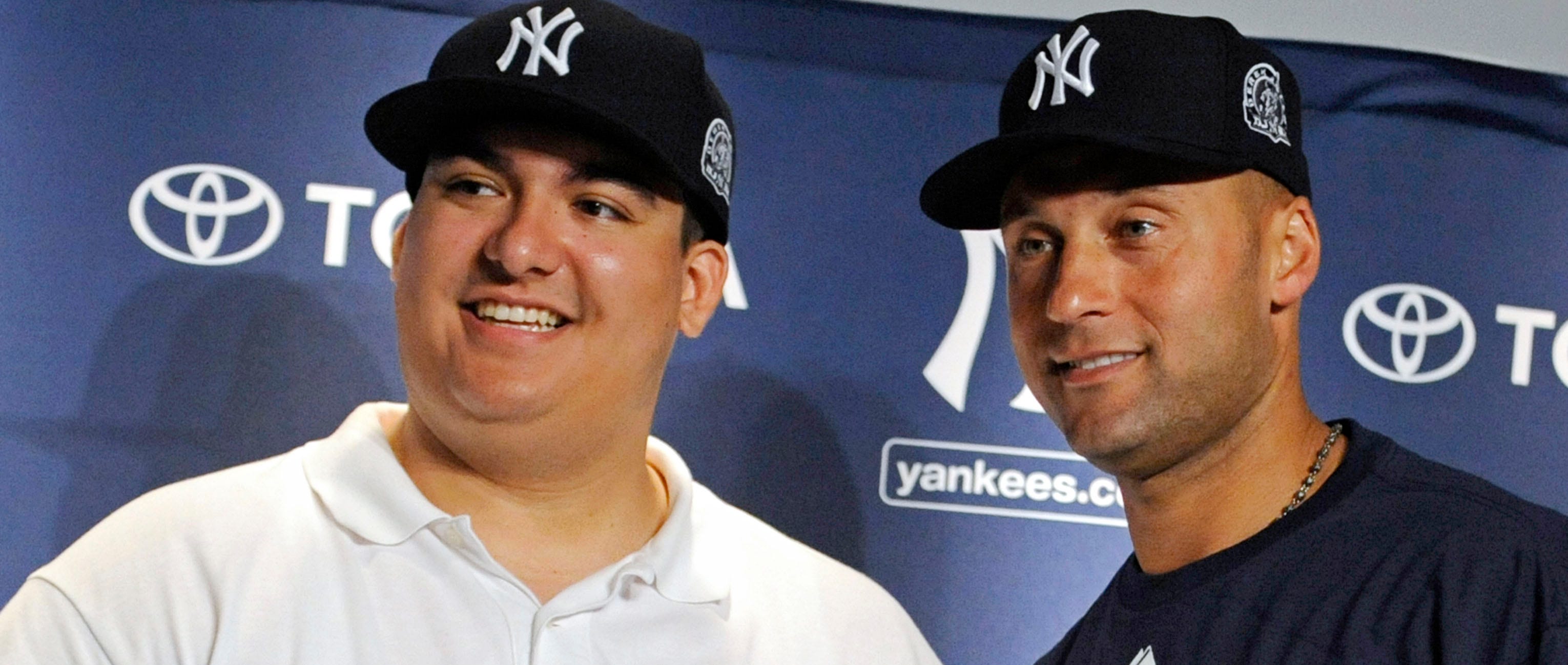 New York Yankees Derek Jeter shakes hands with Christian Lopez