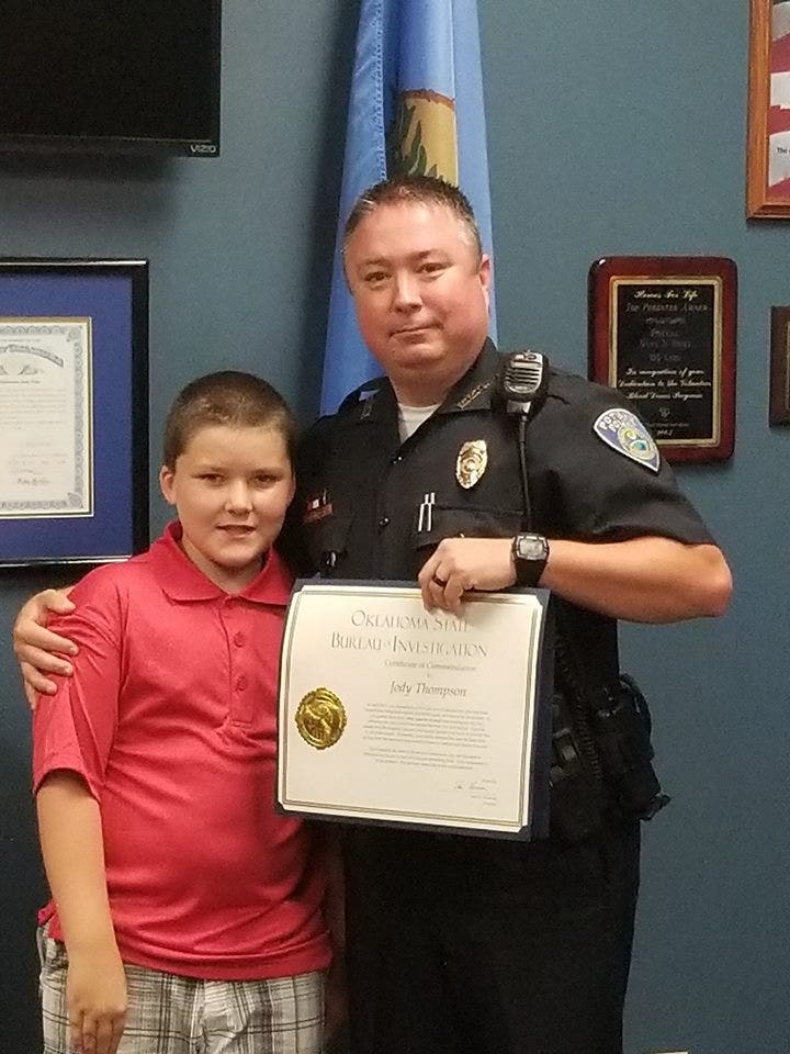 Oklahoma officer honored for adopting 8-year-old boy he saved from ...