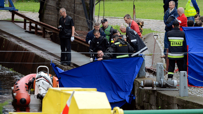 June 20, 2012: Police divers bring in a body found floating in a canal in Bydgoszcz, northern Poland.