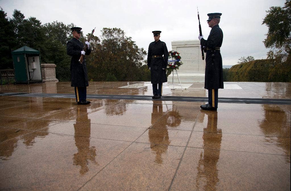 A closeup of the woolen tights and shoes with pompoms of a member of the  Evzones guarding the tomb of the unknown soldier Stock Photo - Alamy