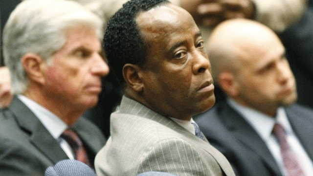 November 7: Conrad Murray remains expressionless next to his attorney J. Michael Flanagan (L) after the jury returned with a guilty verdict in his involuntary manslaughter trial in Los Angeles.