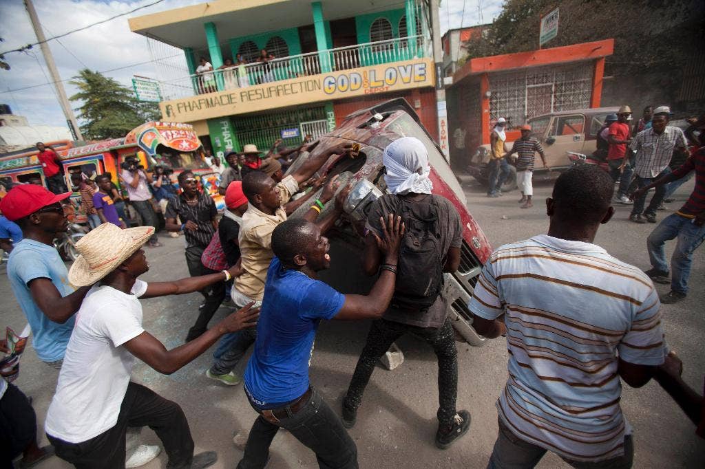 Presiden Haiti membuat kesepakatan pada menit-menit terakhir dengan oposisi untuk mengakhiri pertikaian politik