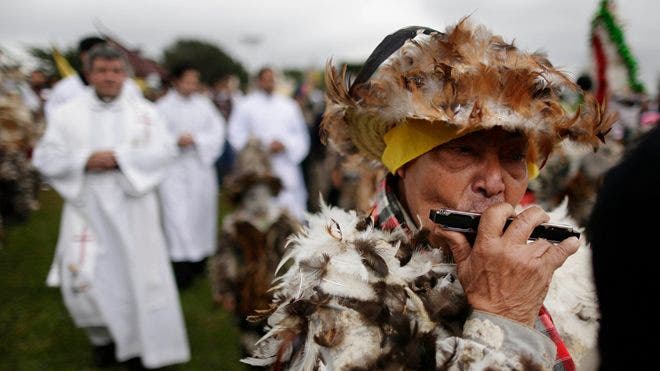 Paraguayans puts on bird-feather suits to pay homage to saint