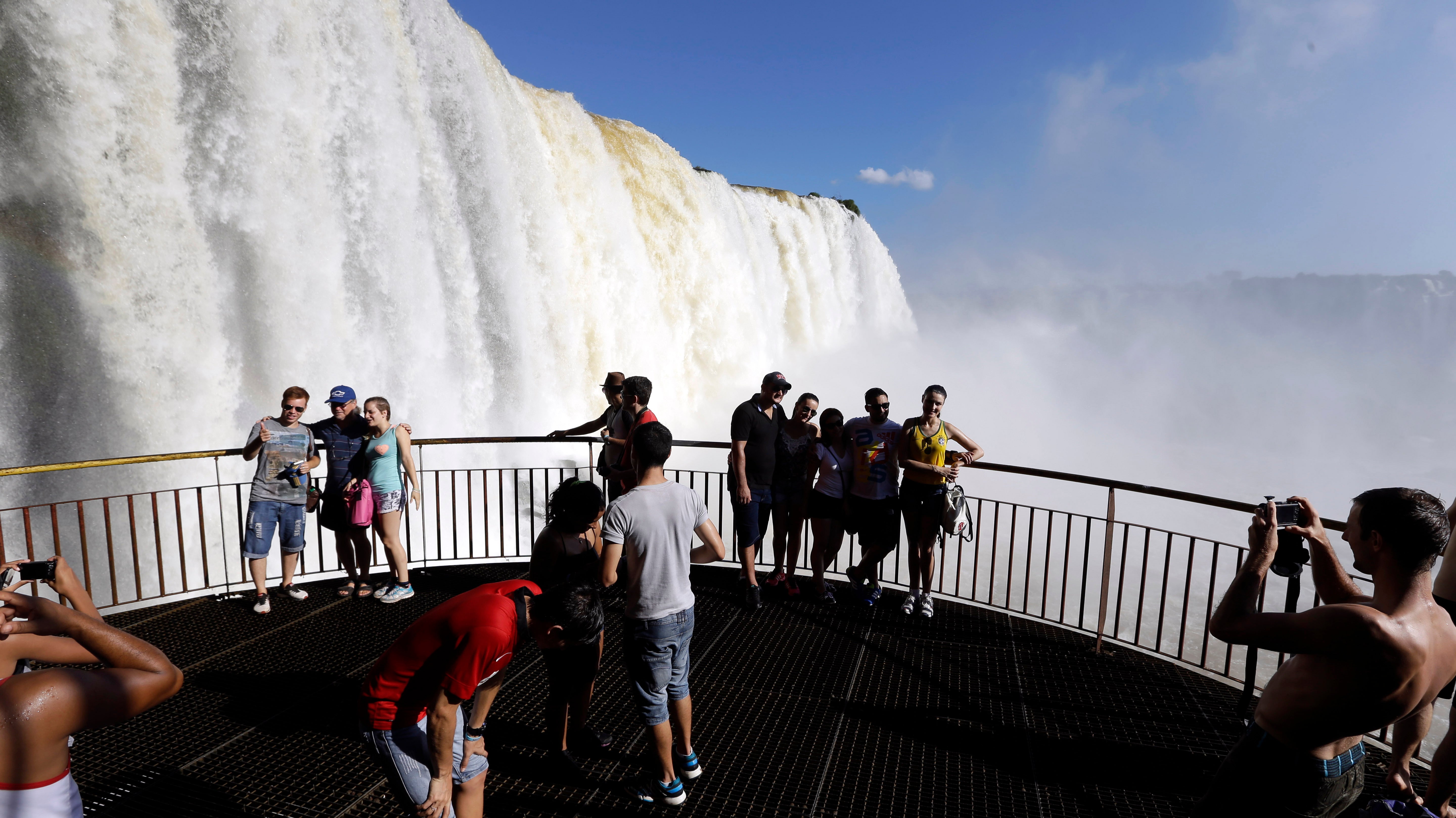 Tourists enjoy South America’s Iguazu Falls