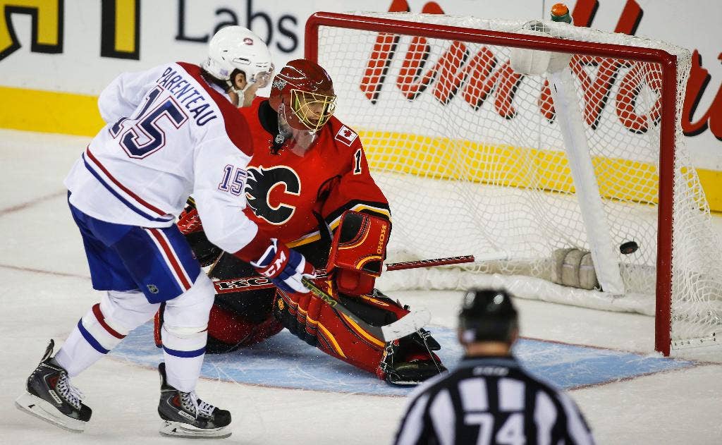 Gol adu penalti Parenteau mengangkat Canadiens menang 2-1 atas Flames