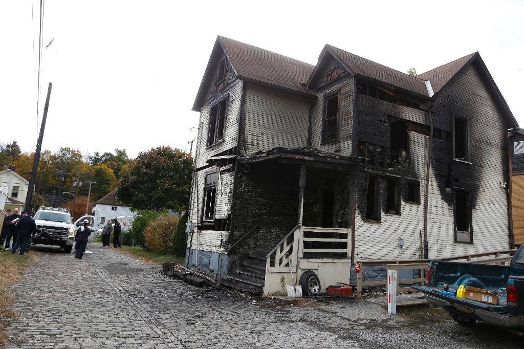 Coroner: 6 fire victims died of smoke inhalation; cause of blaze still ...