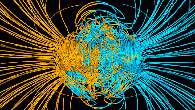 A computer simulation shows the Earth's magnetic field lines and two poles, with blue lines directed inward and yellow lines directed outward.