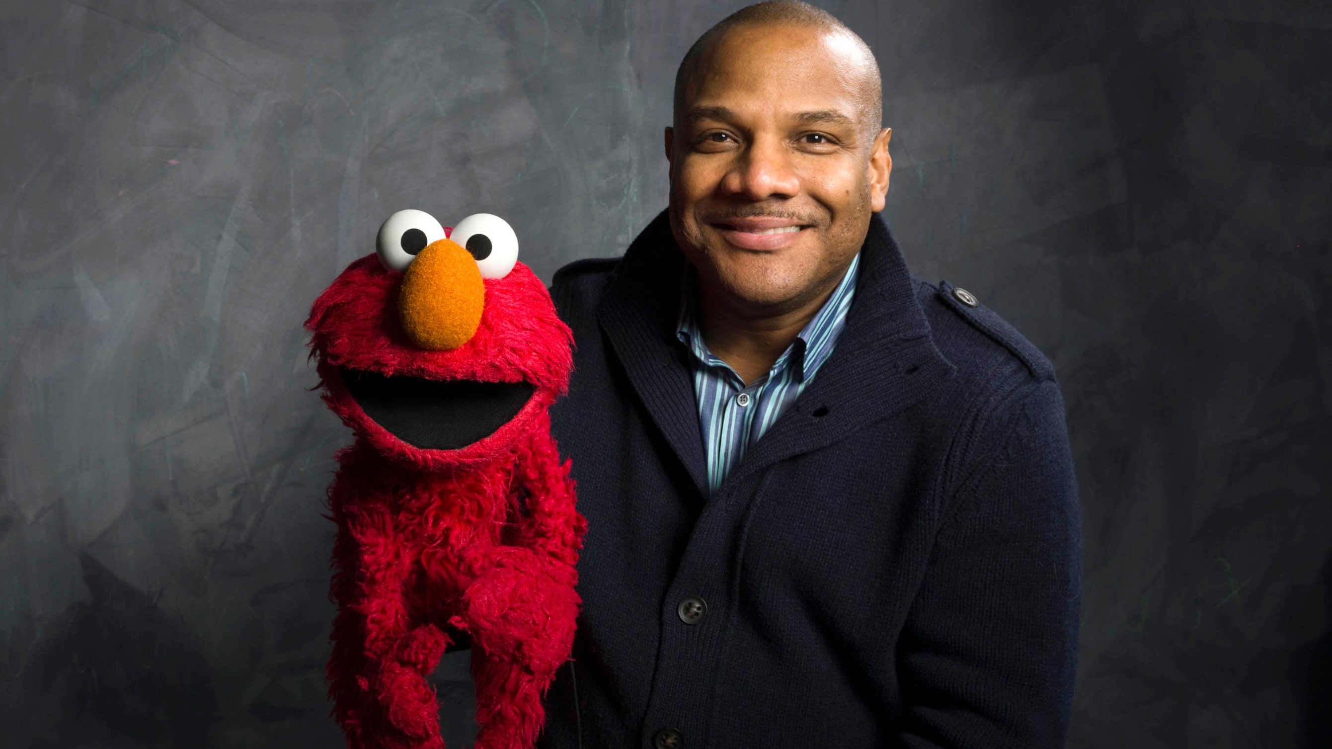 who voices elmo        
        <figure class=