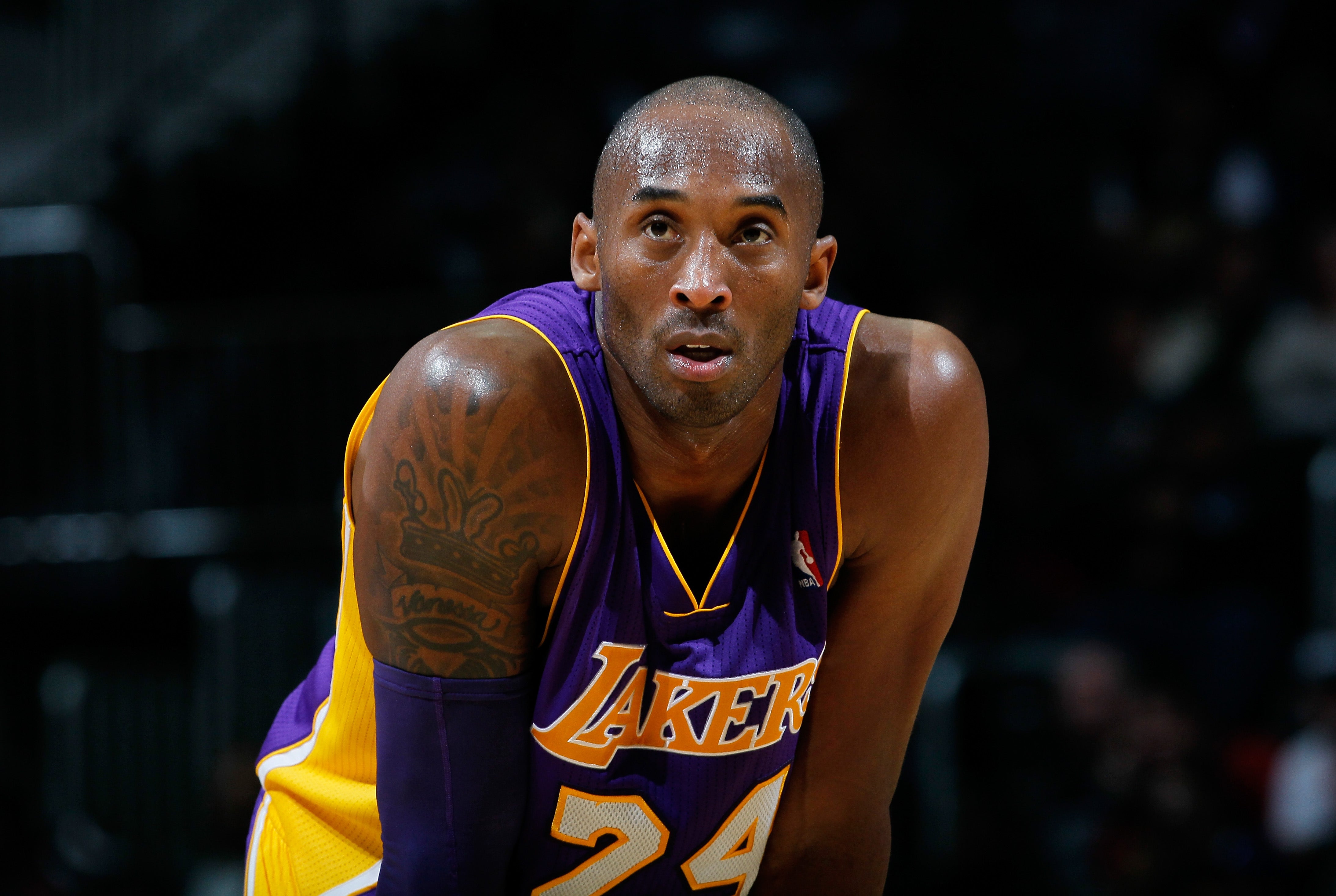 Guard Kobe Bryant of the Los Angeles Lakers stands with center News  Photo - Getty Images