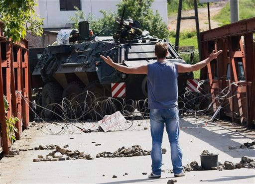 NATO troops confront Serb crowds in Kosovo north | Fox News