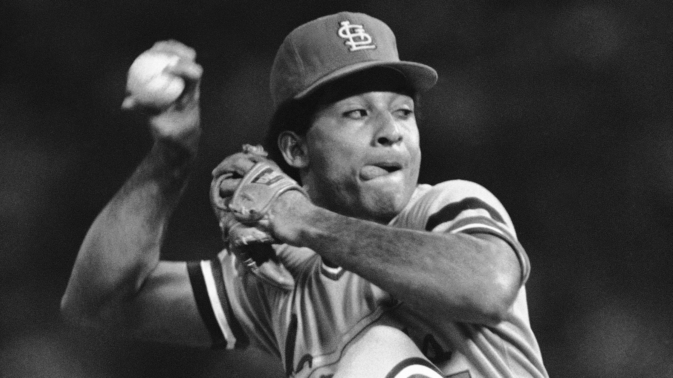 Pitcher Joaquin Andujar #47 of the St. Louis Cardinals is held by