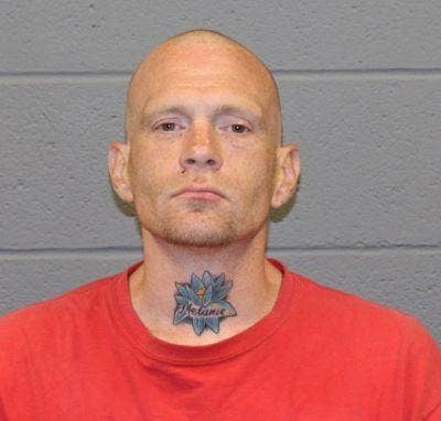 Murder suspect's mugshot shows alleged victim's name tattooed on his neck