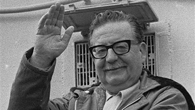 In this 1971 file photo, President Salvador Allende waves to supporters in Chile. A scientific autopsy has confirmed that Allende committed suicide during the 1973 coup, Chilean court officials announced Tuesday.