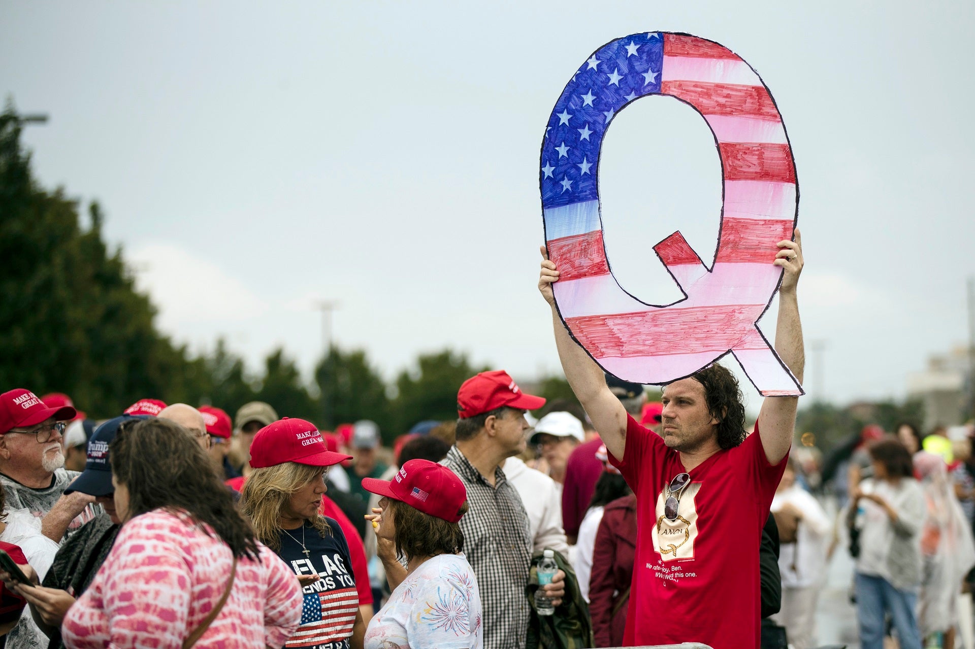 What is QAnon, the conspiracy theory group showing up to Trump rallies?