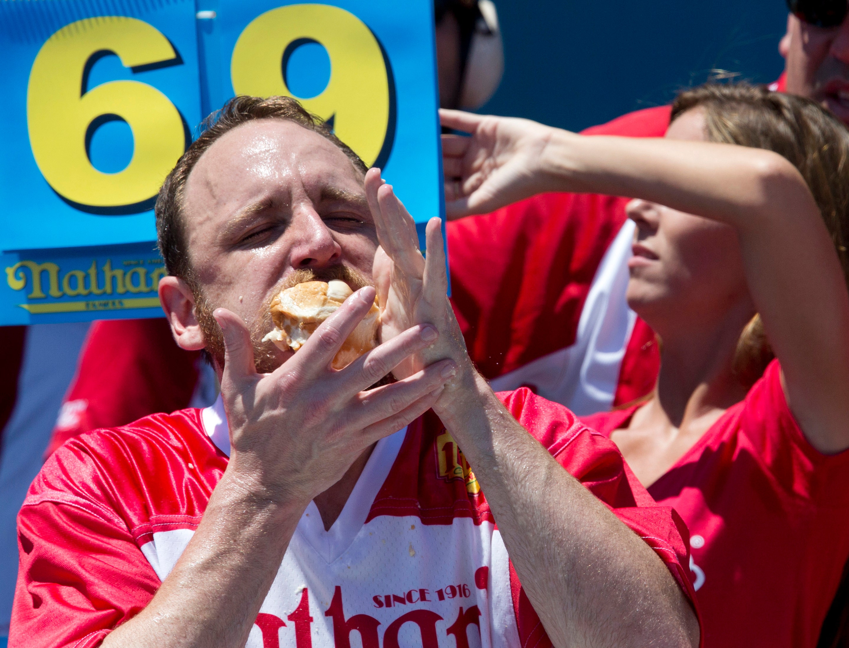 Joey Chestnut celebrates National Chicken Finger Day by going for Raising Cane's record for deep-fried fowl