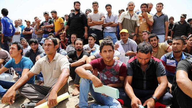 Saddam-era fugitive’s armed group fighting alongside militants in Iraq, officials say
