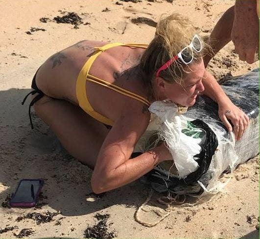Florida Police Searching For Bikini Clad Woman Captured Hugging Bundle