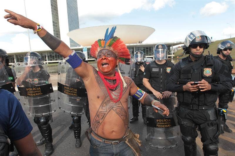 Indigenous protesters in Brazil shoot arrows at police in response to