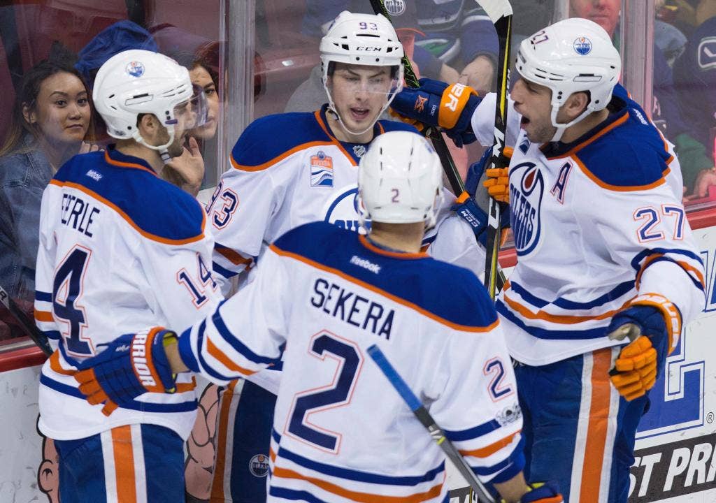 Oilers beat Canucks 3-2, clinch at least second in Pacific