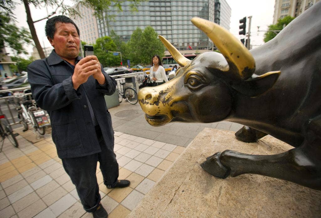 Beijing mencoba untuk mengetuk rem pada booming di stok dan meminta dengan hati -hati setelah kenaikan cepat