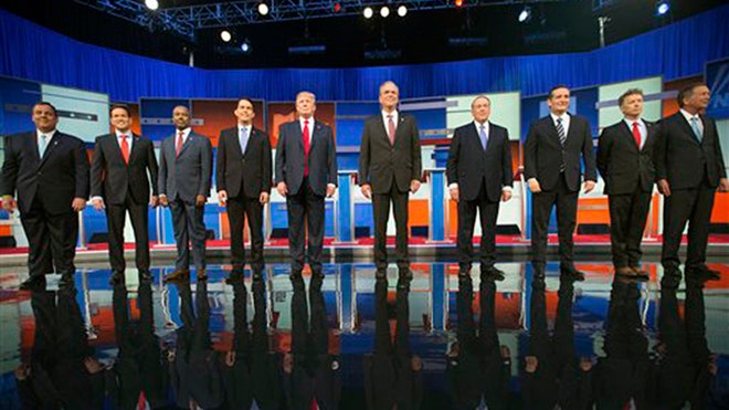 Republican presidential candidates from left, Chris Christie, Marco Rubio, Ben Carson, Scott Walker, Donald Trump, Jeb Bush, Mike Huckabee, Ted Cruz, Rand Paul, and John Kasich take the stage for the first Republican presidential debate at the Quicken Loans Arena, Thursday, Aug. 6, 2015, in Cleveland. (AP Photo/Andrew Harnik)