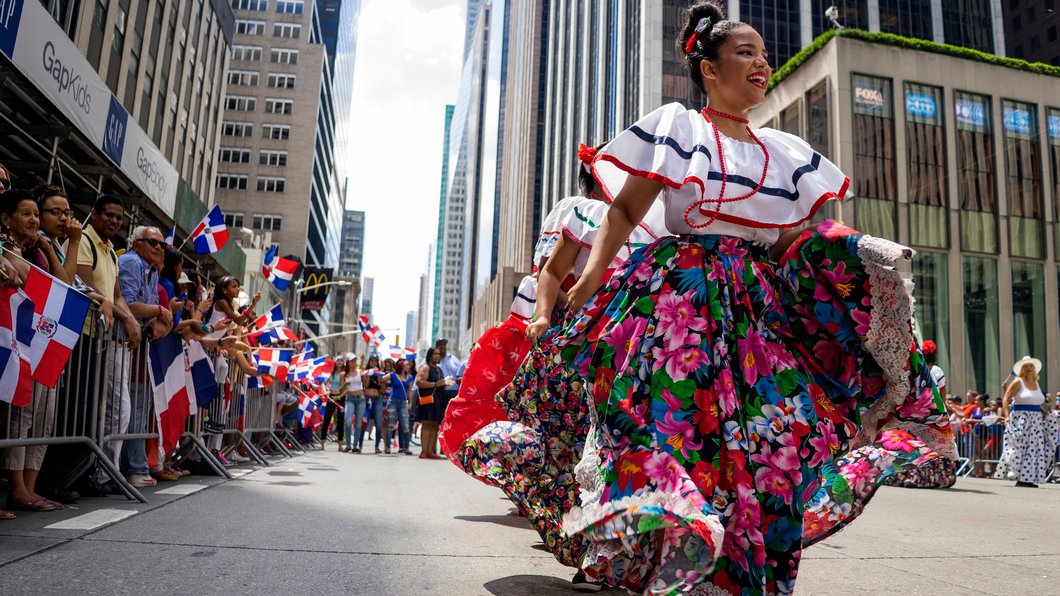 Three police officers injured, six arrested during Dominican Festival ...