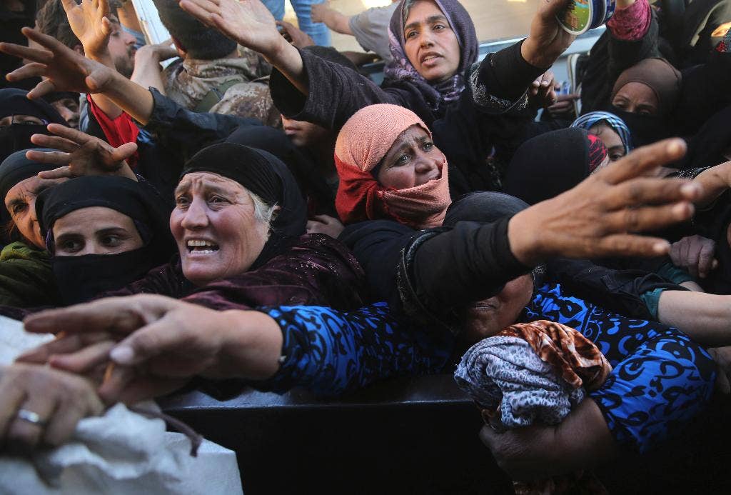 Residents of Iraq's Mosul fight, jostle over food | Fox News