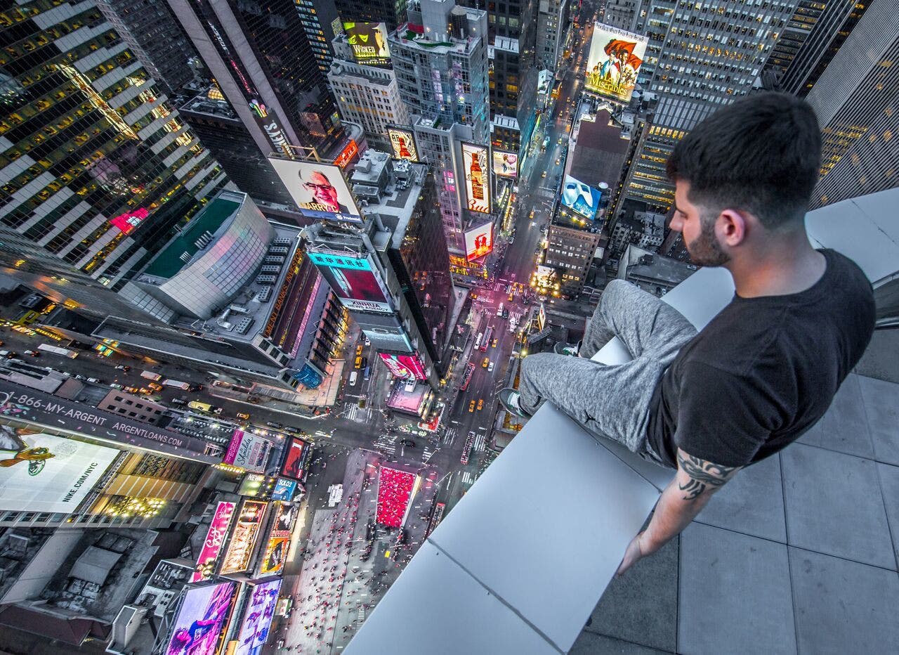Photographer climbs to harrowing heights above Times Square