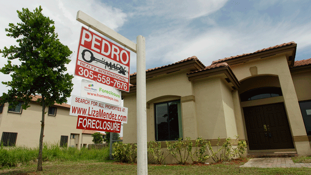 In this Sept. 14, 2010 file photo, a house in Homestead, Fla. sits empty, for sale as a foreclosure home in a neighborhood where half of the houses were empty and up for foreclosure.
