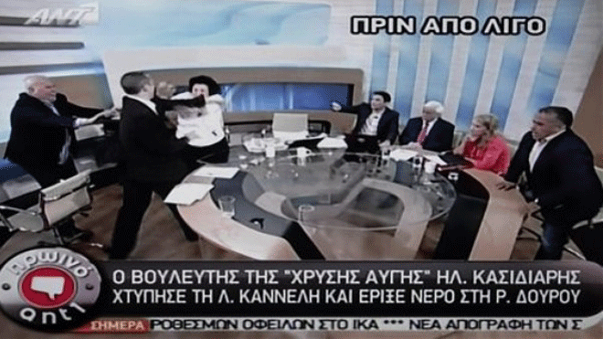 June 7, 2012: In this image taken off a TV screen, Ilias Kasidiaris, 2nd left, spokesman of Greece's extremist far-right Golden Dawn party, who was elected to Parliament in the country's recent inconclusive polls physically assaults Liana Kanelli, a female member of the Parliament for the Greek Communist party during a talk show at the studios of the ANTENA TV station in Athens.