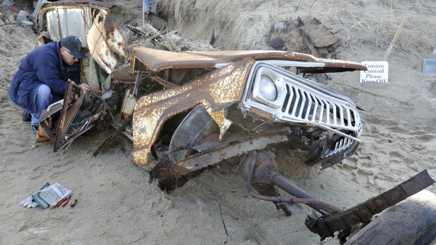 Jeep buried in sand dune for 40 years is finally unearthed
