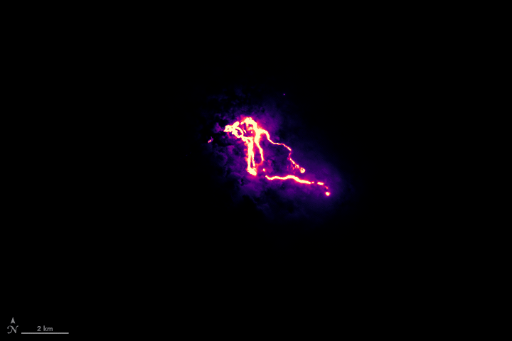 The Operational Land Imager (OLI) instrument on the Landsat 8 satellite acquired the data for this false-color view of the Kilauea lava flow as it appeared on the night of May 23, 2018. The purple areas surrounding the flows are clouds lit from below. This animation also features OLI daytime information about the location of roads and coastlines.