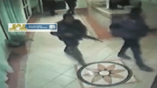 In this frame grab taken from video filmed by a surveillance camera on Jan 20, 2012, and released by the Jalisco state prosecutors' office on June 14, 2012, police officers enter a hotel before escorting out three men in their underwear with their hands tied behind their backs and some blindfolded in Lagos de Moreno, Mexico.