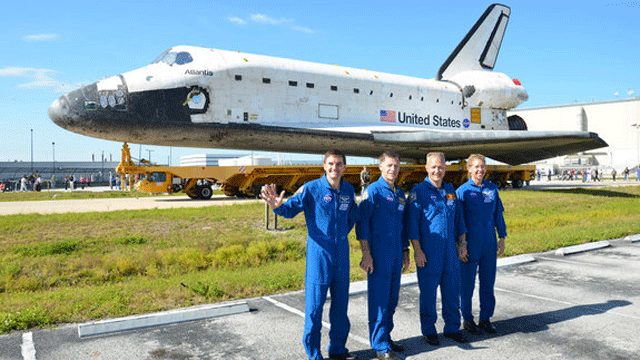 The crew of STS-135, NASA's final mission for its space shuttle program, pose in front of their spacecraft, space shuttle Atlantis on May 17, 2011. From left to right: mission specialist Rex Walheim, commander Chris Ferguson, pilot Doug Hurley and mission specialist Sandra Magnus.