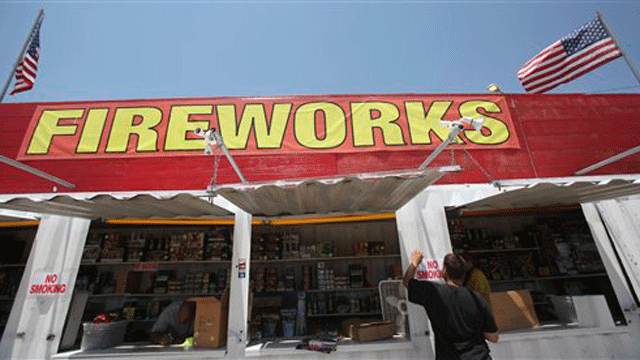 June 30: Josh Wessner tapes up a no smoking sign at a fireworks stand in Lincoln Park, Texas. From Texas to Arizona to Georgia, there will be fewer oohs and aahs at the rockets' red glare this Fourth of July: Many cities and counties across the drought-stricken region are banning fireworks because of the risk of wildfires.