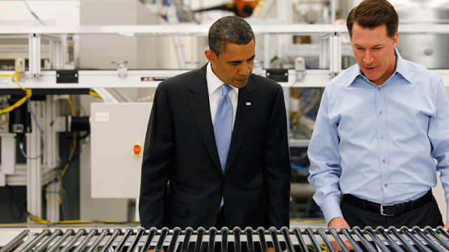In this May 26, 2010, file photo, President Obama and Solyndra Chief Executive Officer Chris Gronet look at a solar panel during a tour of Solyndra, Inc.