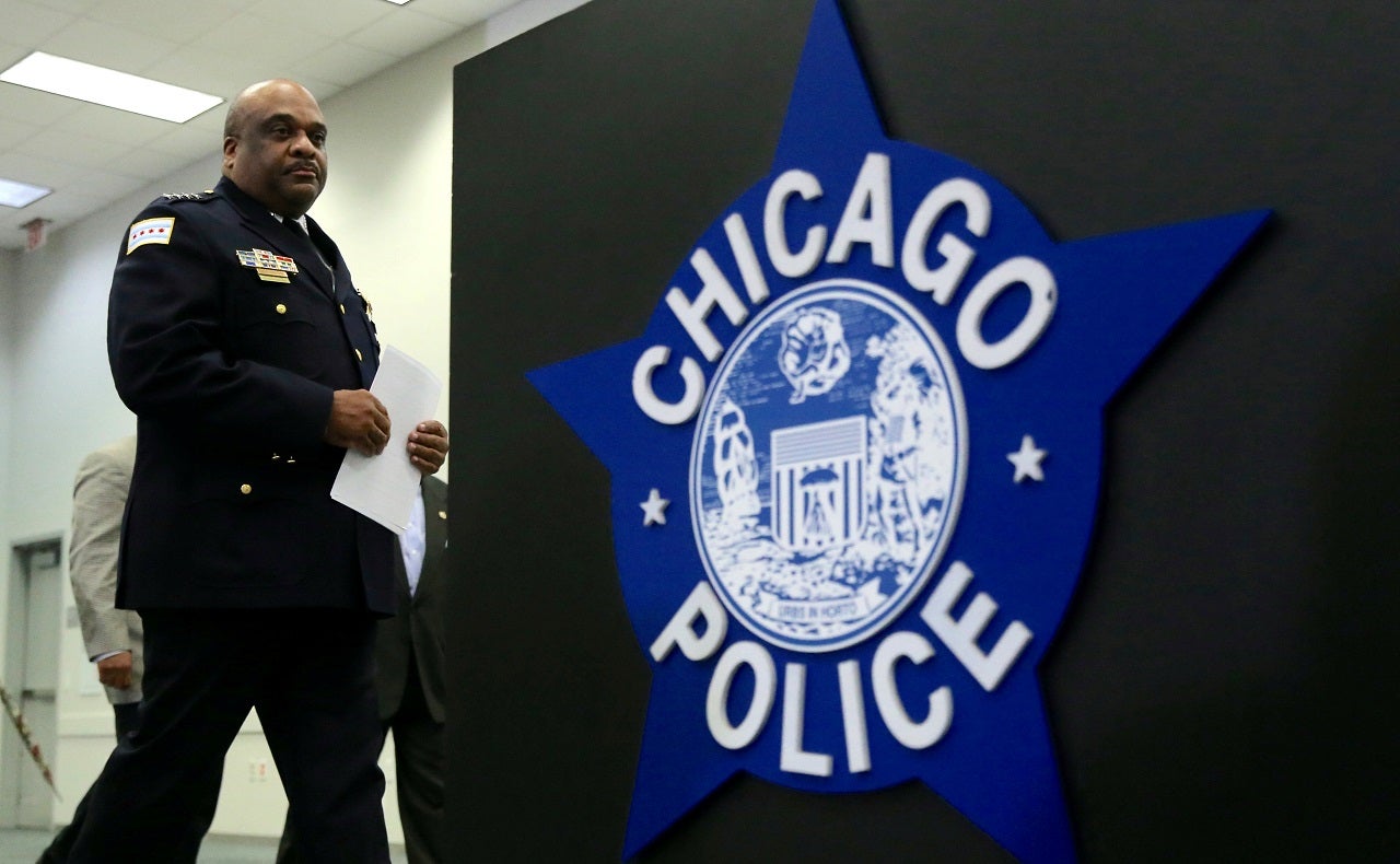 Sign of Chicago police next to officer