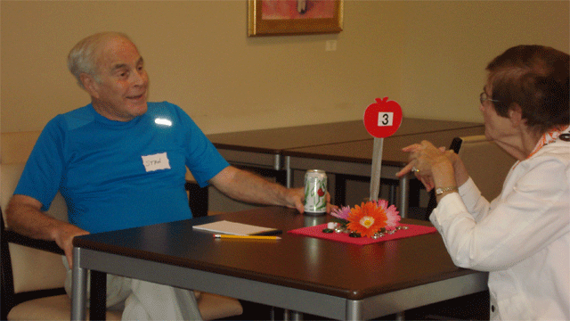 Two seniors share a few words over refreshments at the Weisman Delray Community Center's speed dating event in hopes of finding that special someone.