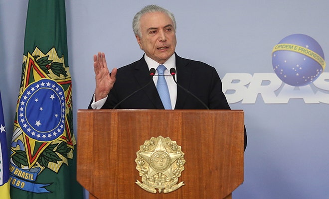 Brazil's embattled president survives vote on bribery charge