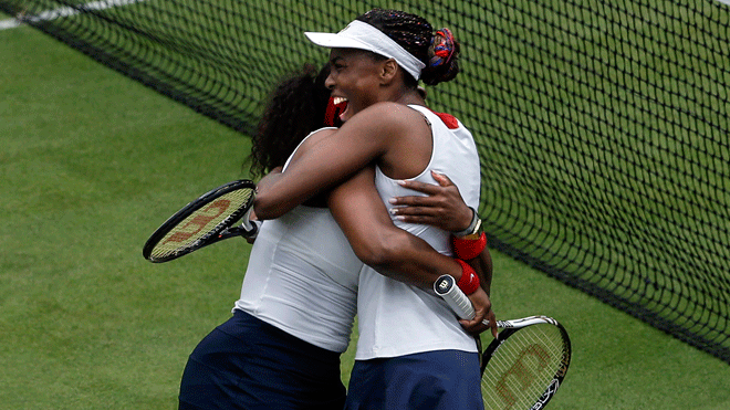 Aug. 5, 2012: United States' Serena Williams, left, celebrates with partner Venus Williams, right, after defeating Czech Republic's Lucie Hradecka and Andrea Hlavackova in a women's doubles gold medal tennis match at the All England Lawn Tennis Club at Wimbledon, in London, at the 2012 Summer Olympics.