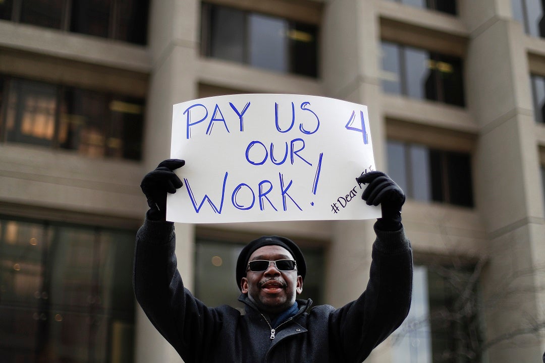 Trump signs bill giving back pay to federal workers after partial shutdown, White House says