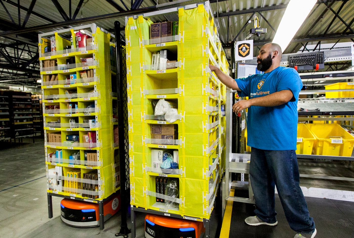 Amazon workers get high-tech belts to keep them safe among warehouse robots