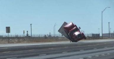 SEE IT: Strong winds blow over tractor-trailer traveling in Texas thumbnail