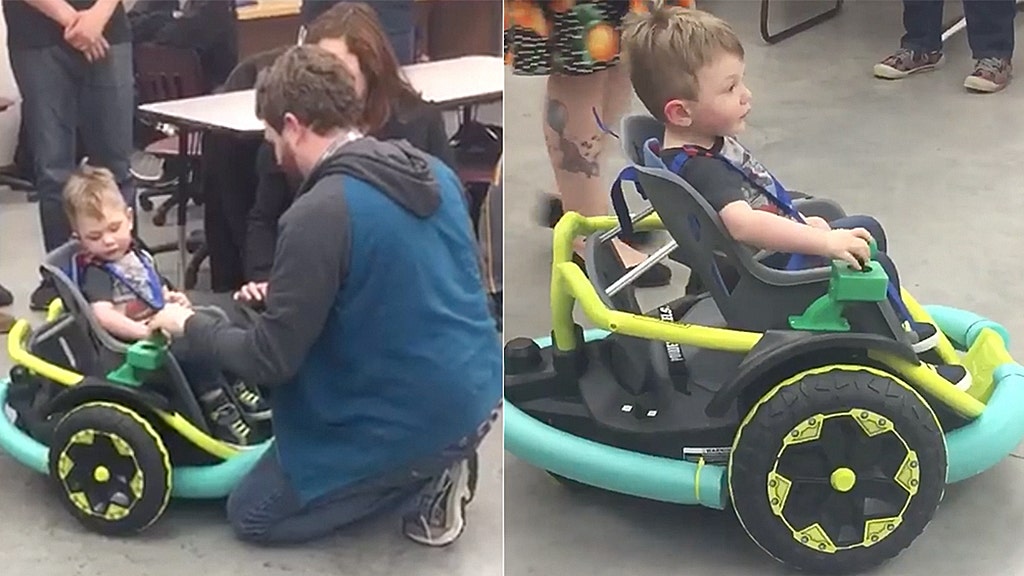 Minnesota high school robotics team designs power wheelchair for 2-year-old whose family couldn't afford one