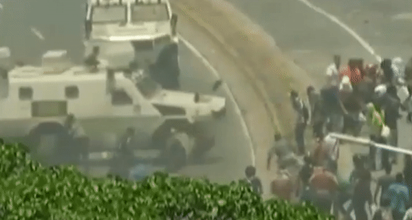 DRAMATIC VIDEO: Armored vehicle plows into crowd in Caracas as Guaido calls for military uprising