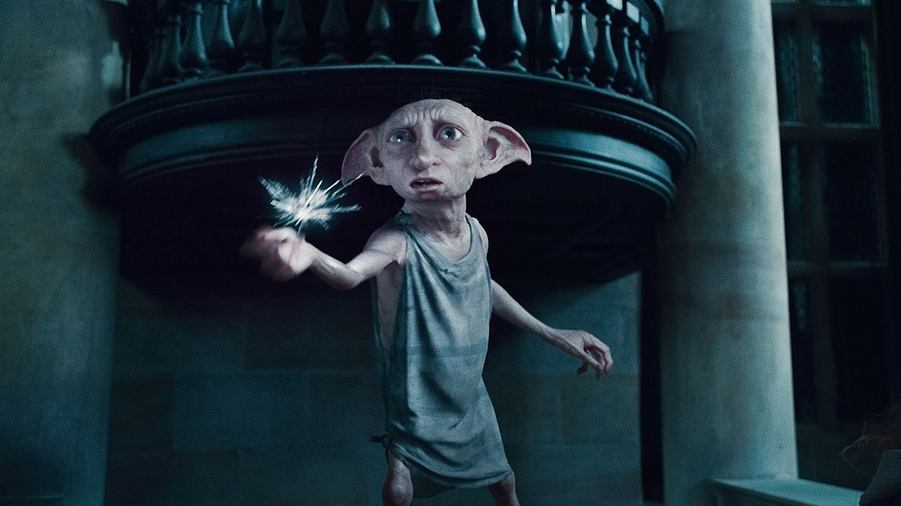 Dobby from harry potter giving a speech on Craiyon