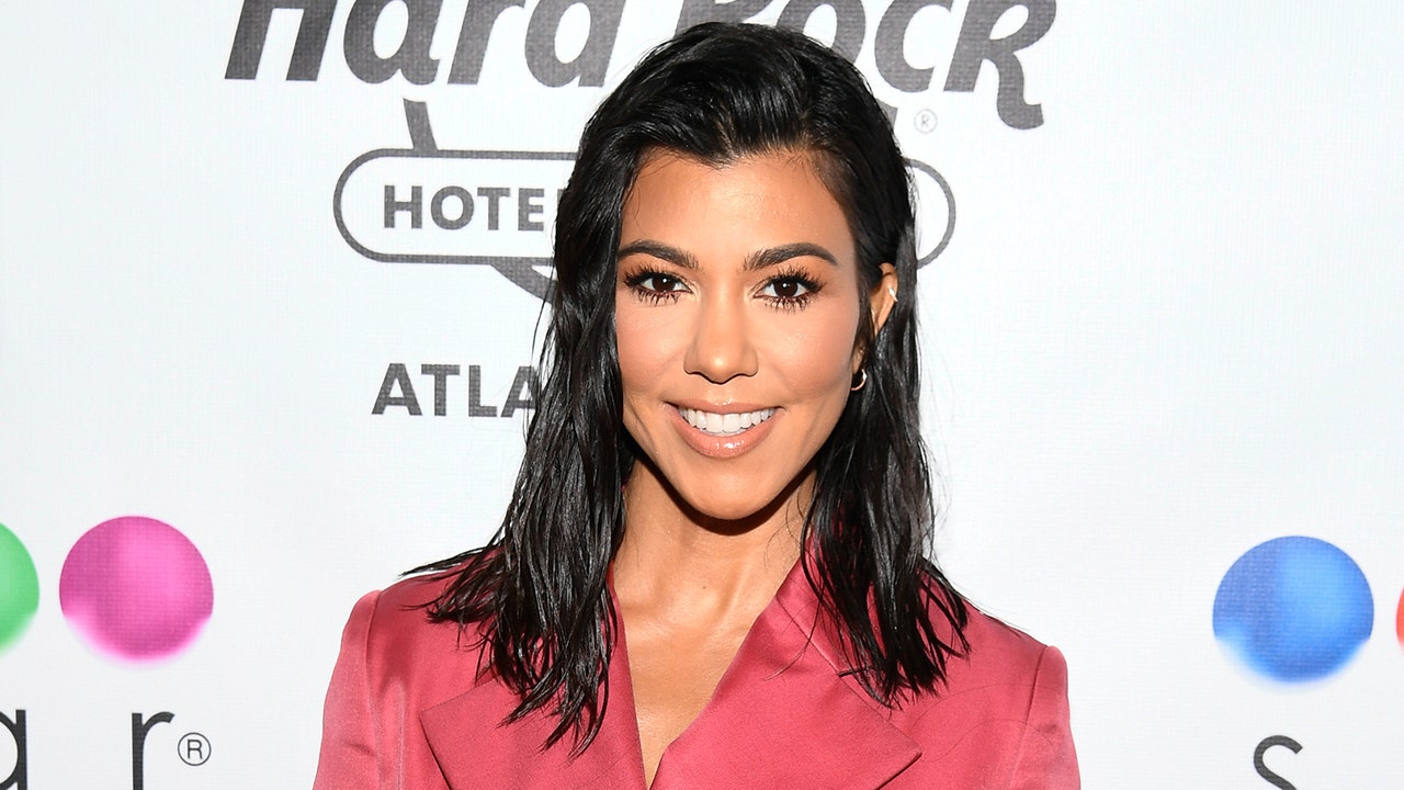 Kourtney Kardashian poses for swimsuit photos