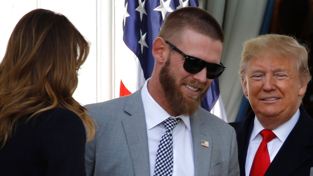 Trump hugs Washington Nationals' Kurt Suzuki, wearing 'MAGA' hat during  White House visit