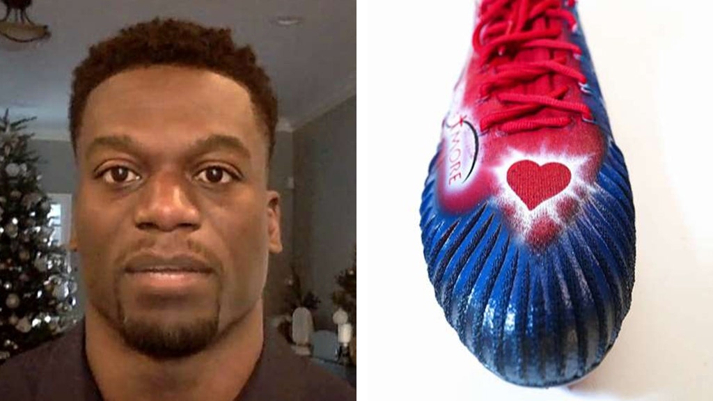 Football player Benjamin Watson and his football cleats