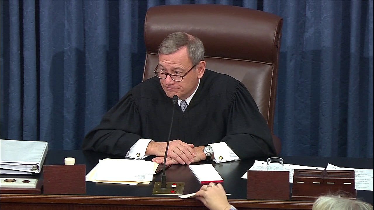 Roberts visibly reacts to Warren's impeachment question about his 'legitimacy' without trial witnesses